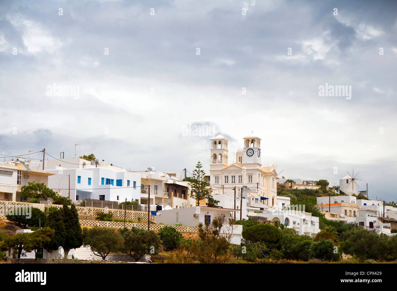Milos Cyclades Greece Greek island Greek island travel typical architecture white buildings blue shutters church dome blue cathe Stock Photo