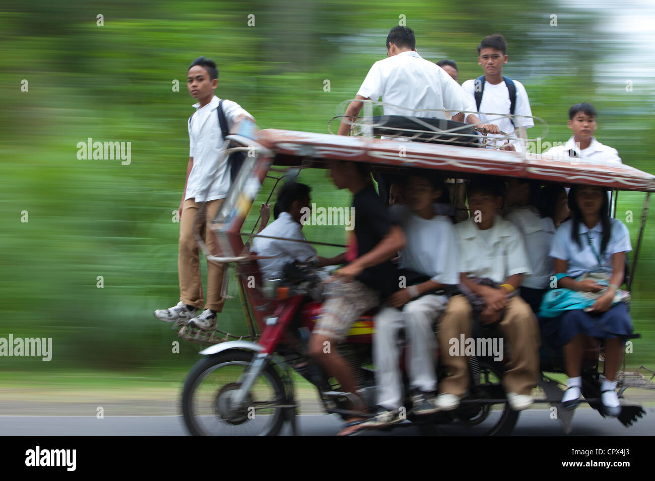 an overloaded tricycle, Negros, Philippines Stock Photo