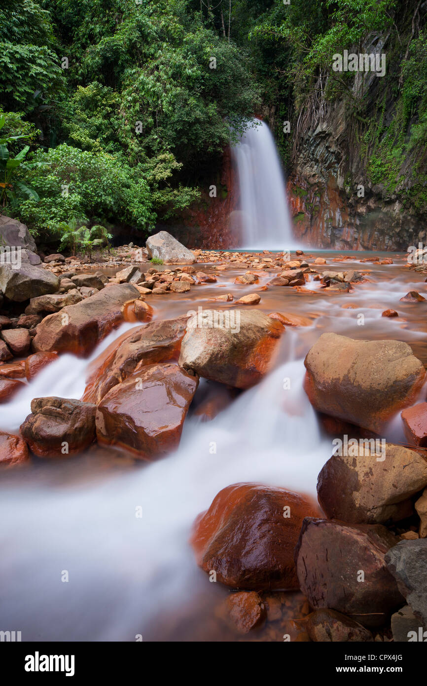 the red rocks coloured by the geothermal waters at Pulangbato Falls on ...