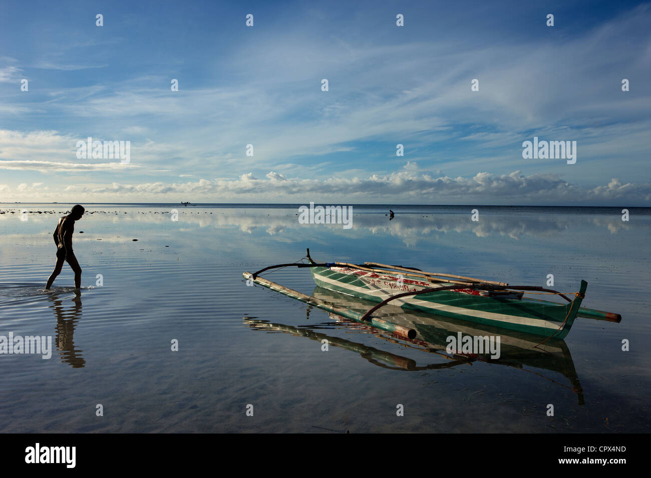 a man collecting shells during low tide, Siquijor, The Visayas, Philippines Stock Photo