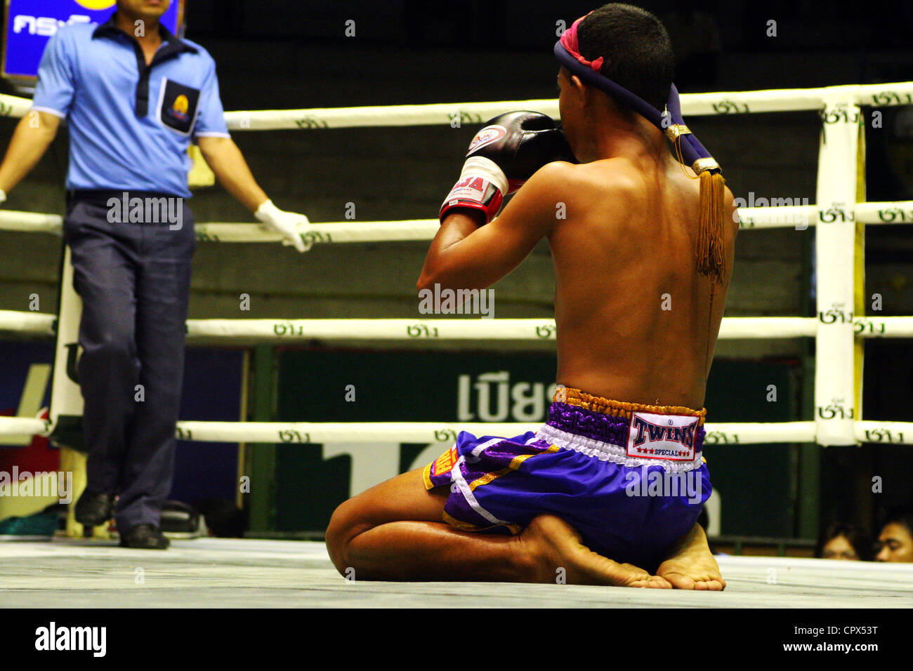 A boxer prepares for a fight at the Rajadamern Muay Thai Stadium in Bangkok, Thailand. Stock Photo