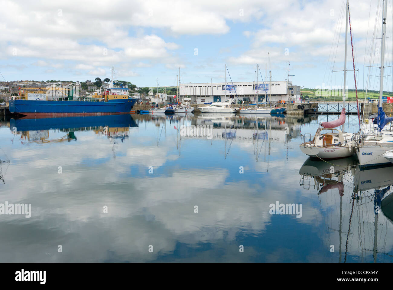 Penzance inner harbour boats calm still sea water reflections. Stock Photo