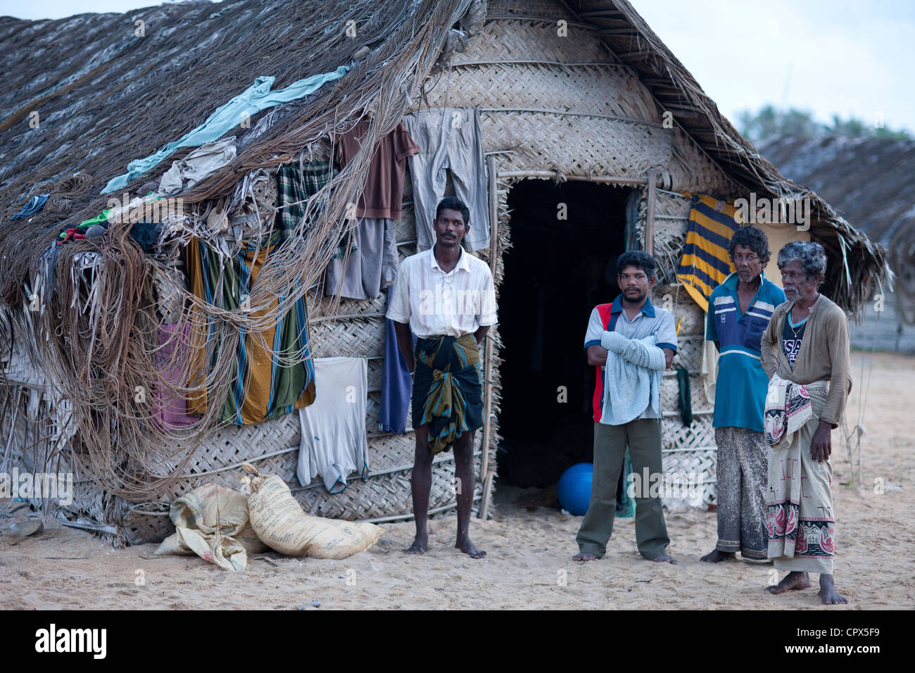 fishermen in front of their beach hut at Kalpitiya, Sri Lanka Stock Photo