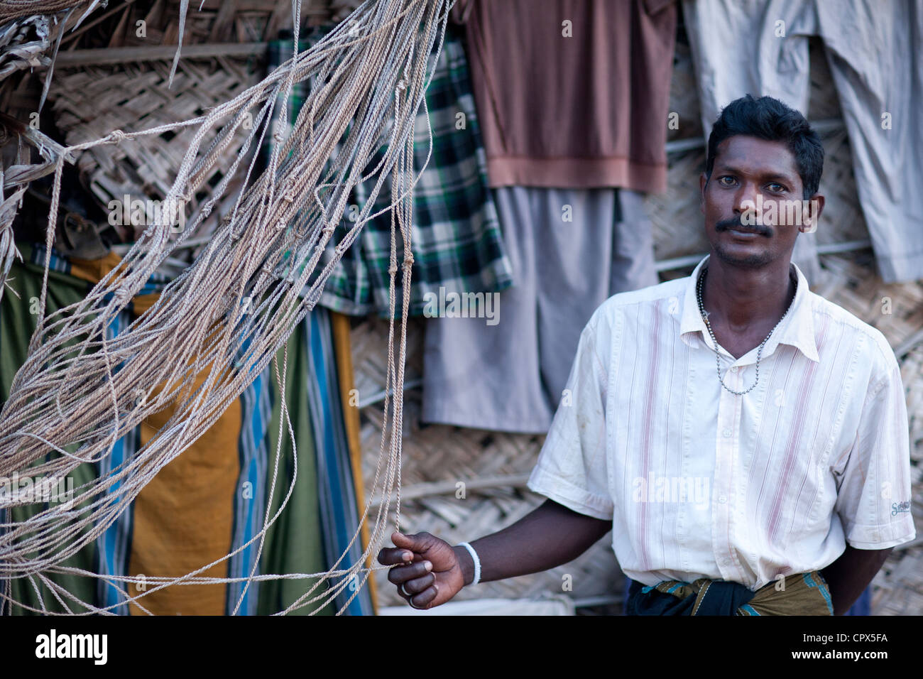 a fisherman in front of his beach hut at Kalpitiya, Sri Lanka Stock Photo