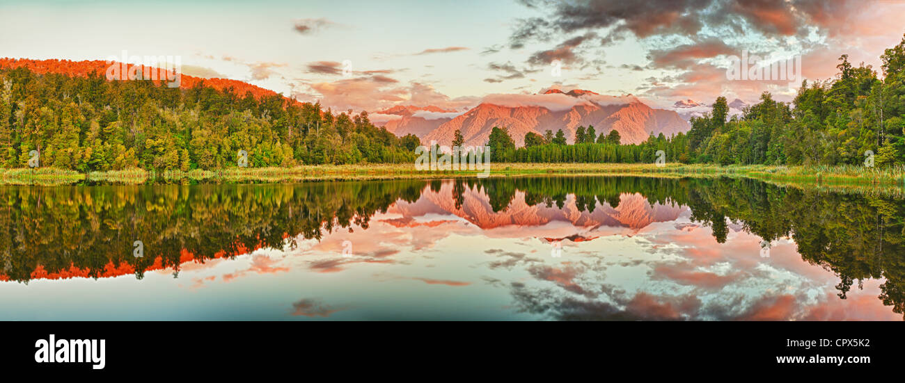 Reflection of the mountains in Matheson lake. Panorama Stock Photo - Alamy