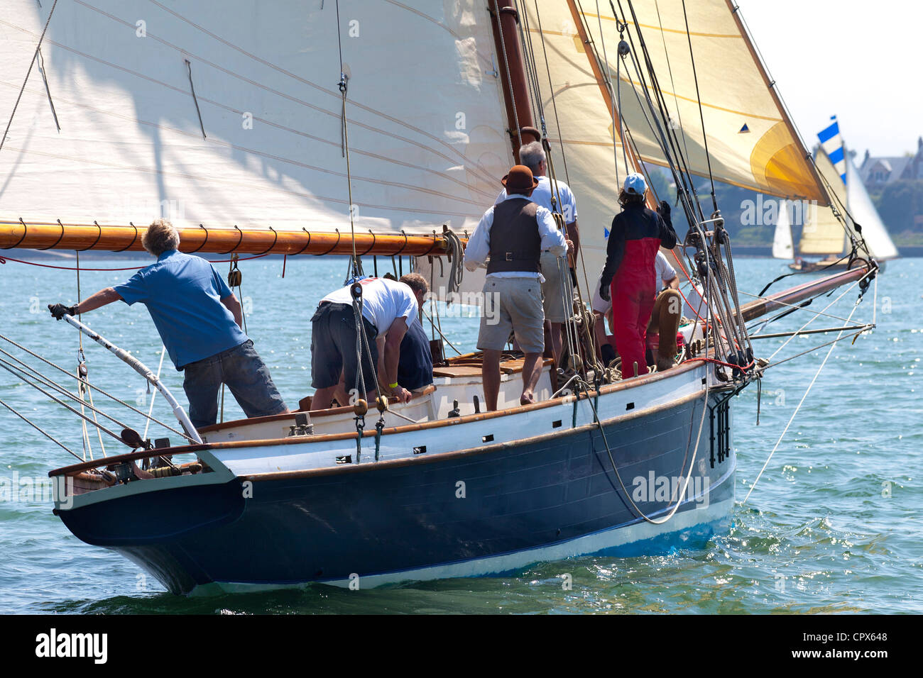 Old Gaffer tanned sail sailing in Yarmouth Festival Jubilee nostalgic Celebrations Stock Photo