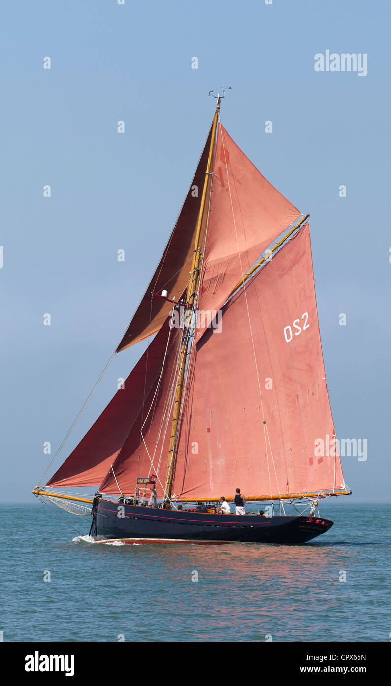Old Gaffer tanned sail sailing in Yarmouth Festival Jubilee nostalgic Celebrations Stock Photo