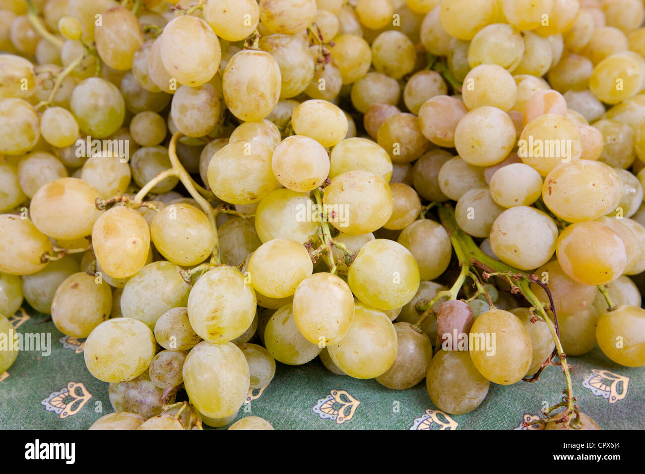 Fresh green grapes on sale at weekly street market in Panzano-in-Chianti, Tuscany, Italy Stock Photo