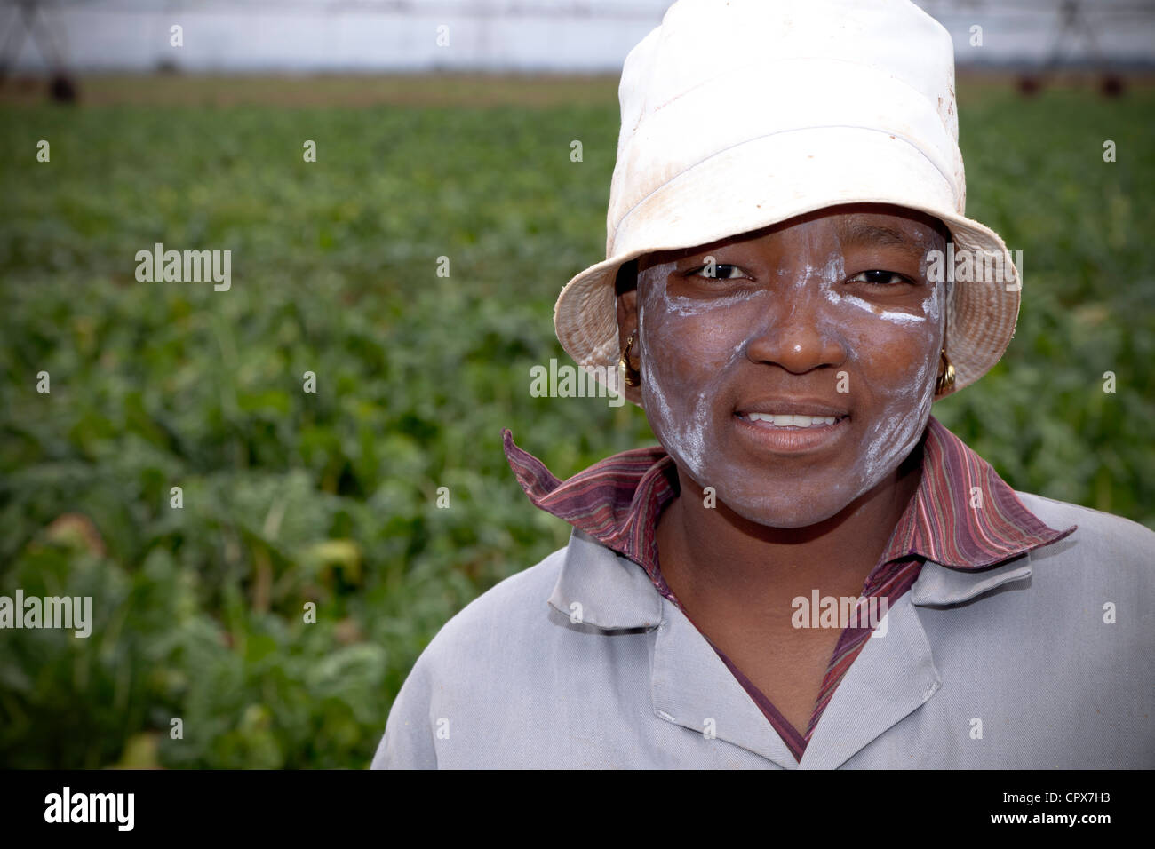 Farmworker poses in a vegetable field Stock Photo