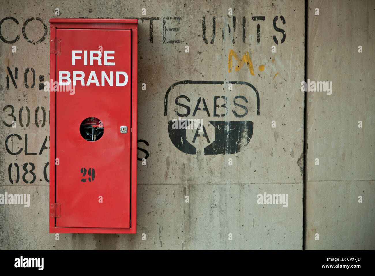 Closeup of a wall with a safety fire box mounted Stock Photo