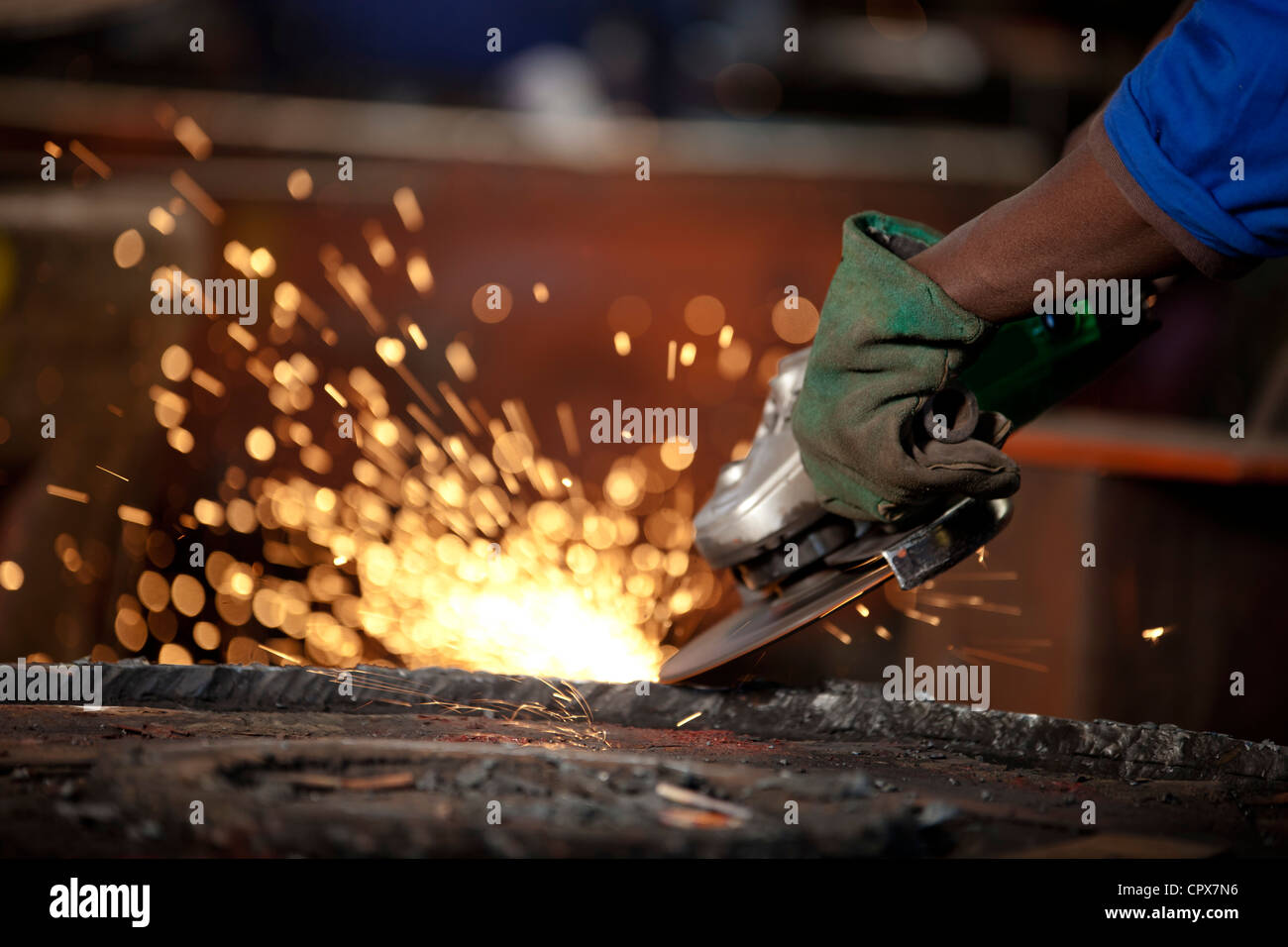 Grinding an industrial magnet in a magnet factory, Gauteng, South Africa Stock Photo