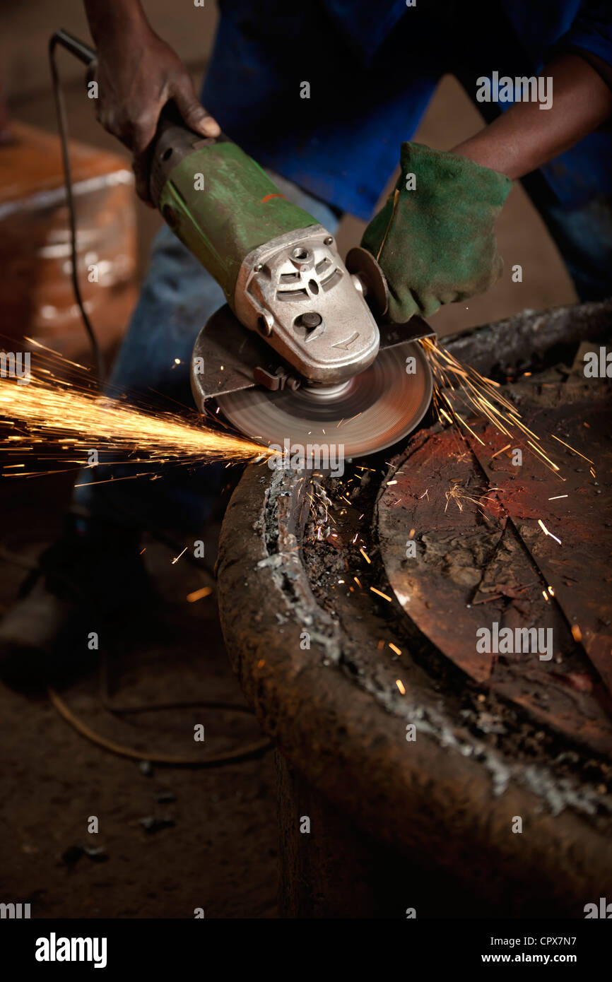 Grinding an industrial magnet in a magnet factory, Gauteng, South Africa Stock Photo