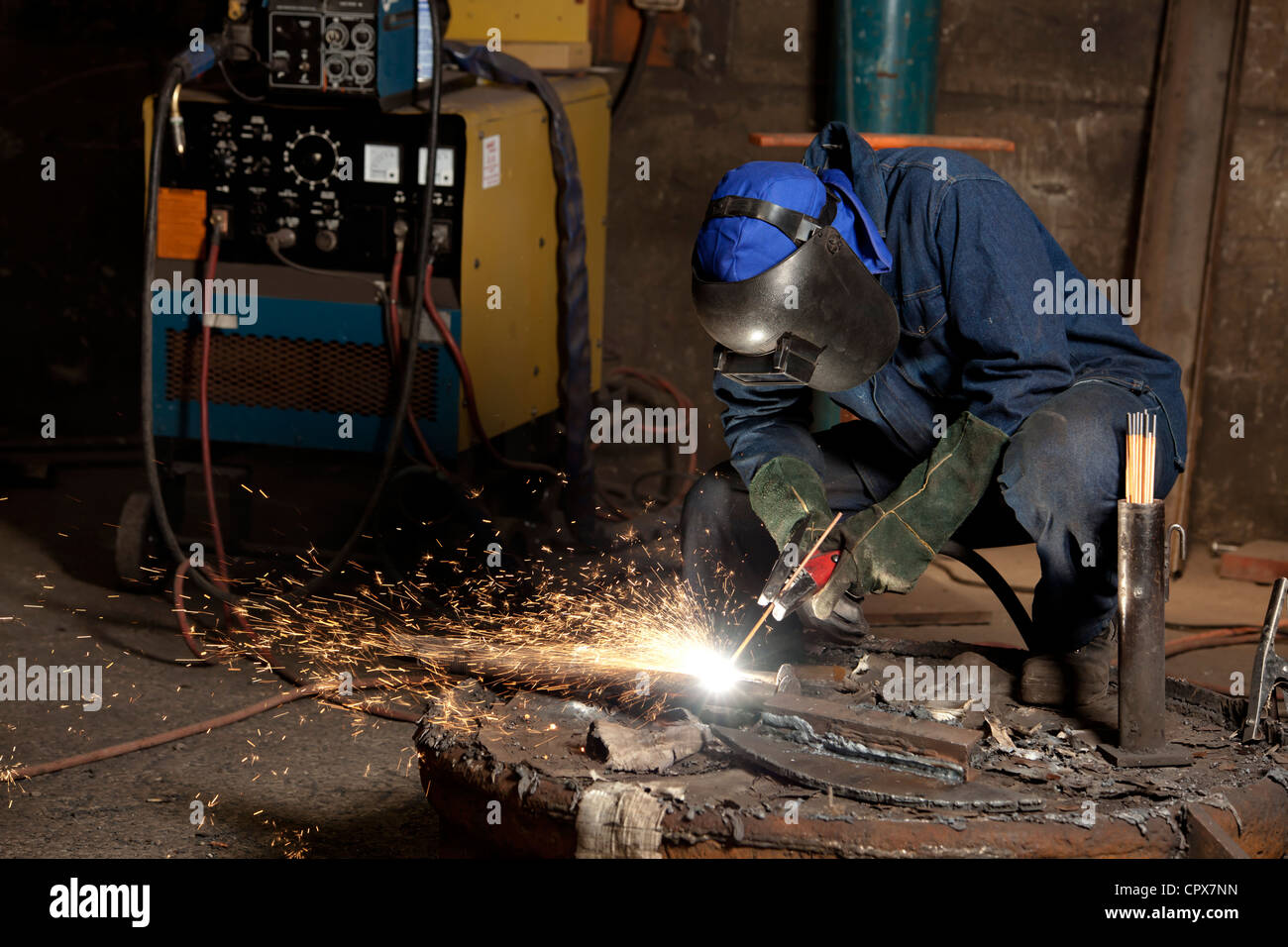 Gouging refurbished industrial magnet in magnet factory, Gauteng, South Africa Stock Photo