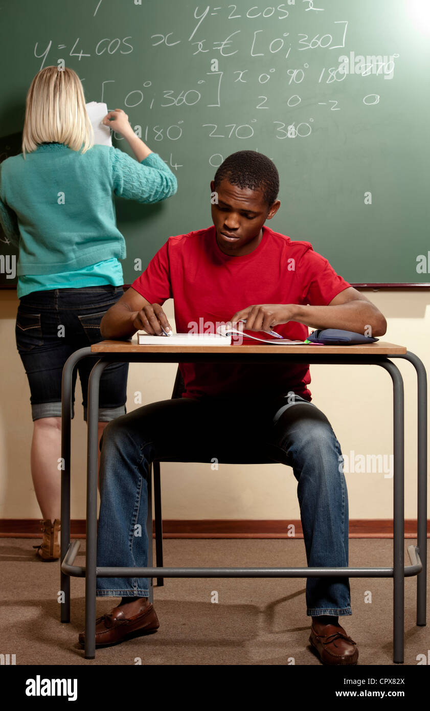 Teacher sitting desk full view hi-res stock photography and images - Alamy