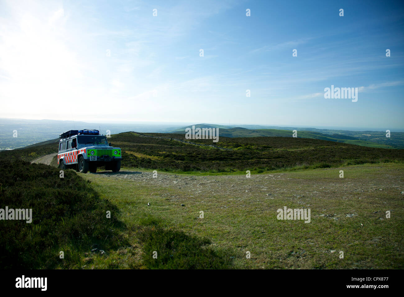 North East Wales Search and Rescue vehicle travelling along the Offas Dyke Path to the top of Moel Famau for event support, Wales, Uk Stock Photo