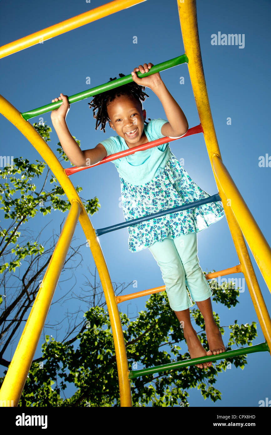 Little girl playing in a playground Stock Photo