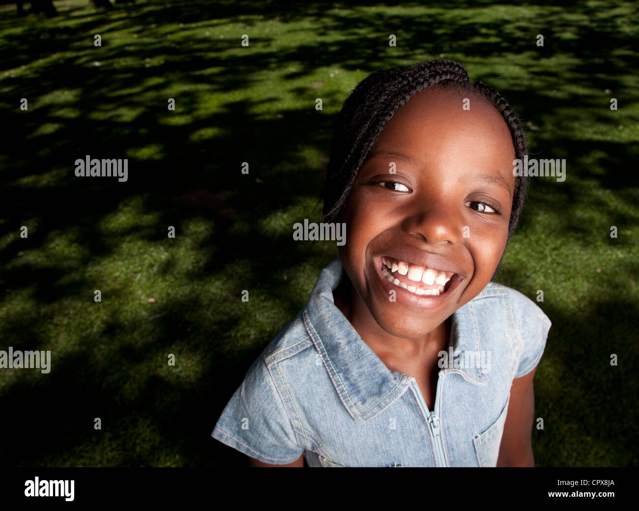 Closeup of a little girl smiling at the camera Stock Photo - Alamy
