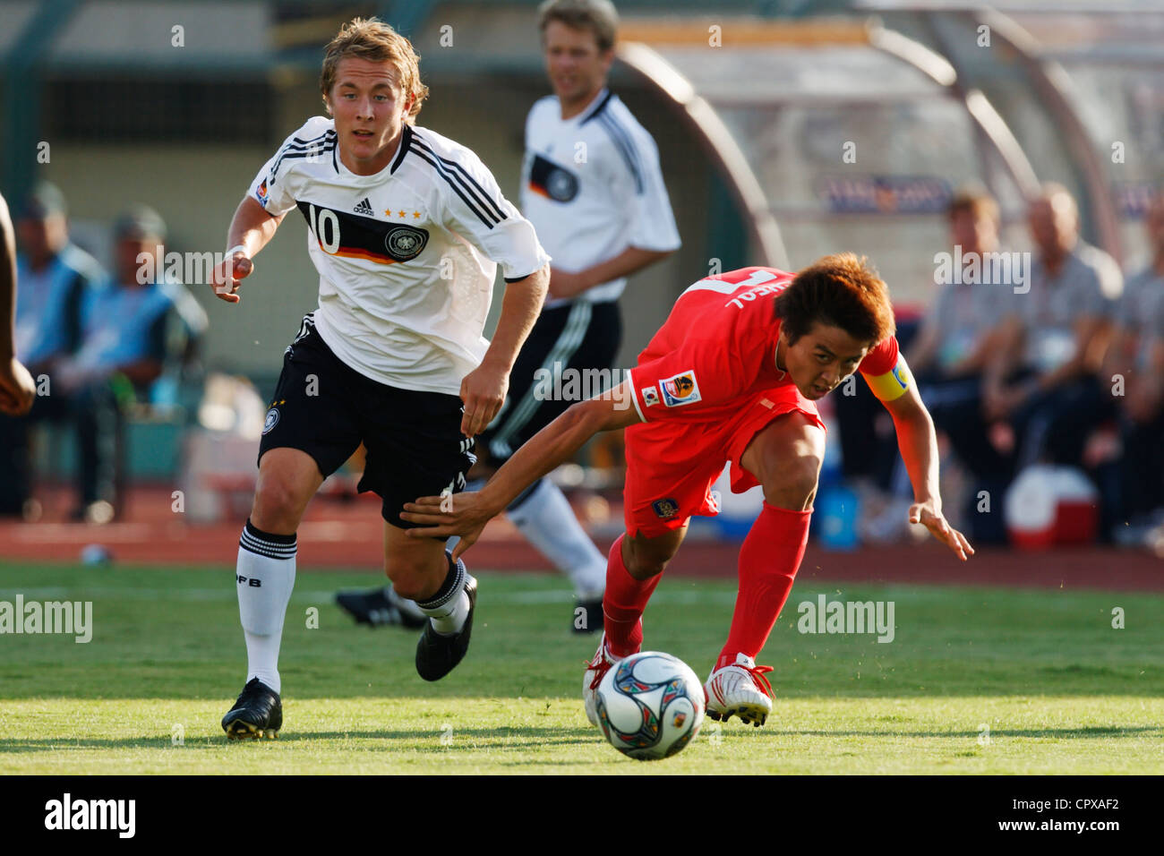 Lewis Holtby of Germany (L) and Ja Cheol Koo of South Korea (R) chase the ball during a FIFA U-20 World Cup Group C match Stock Photo