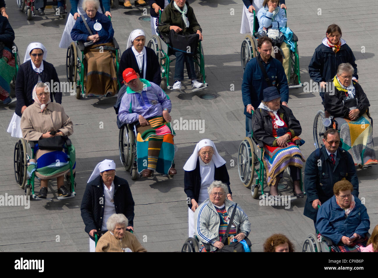 Wheelchairbound Christian pilgrims at the Rosary Basilica, Lourdes