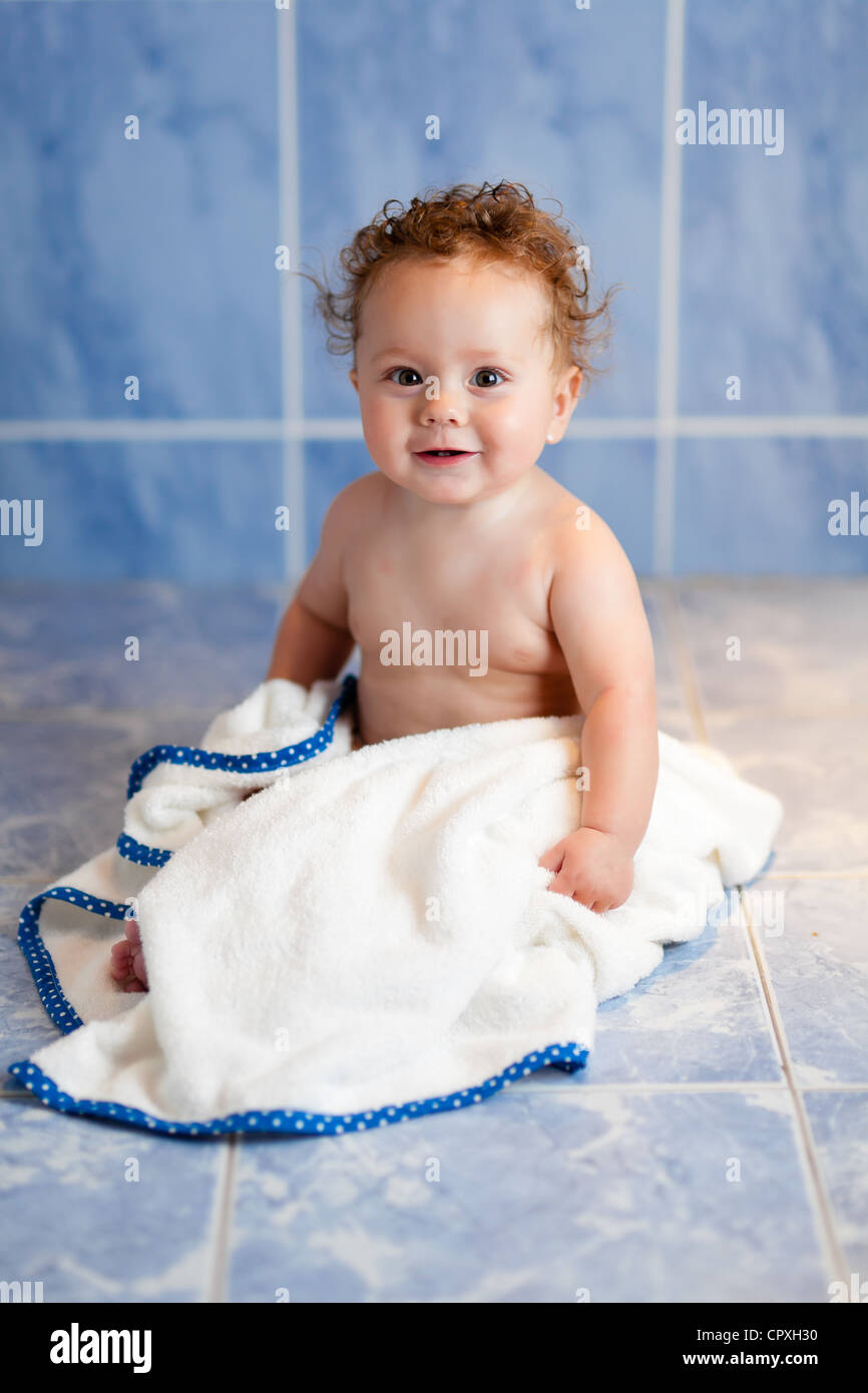 smiling baby boy in bath towel Stock Photo Alamy