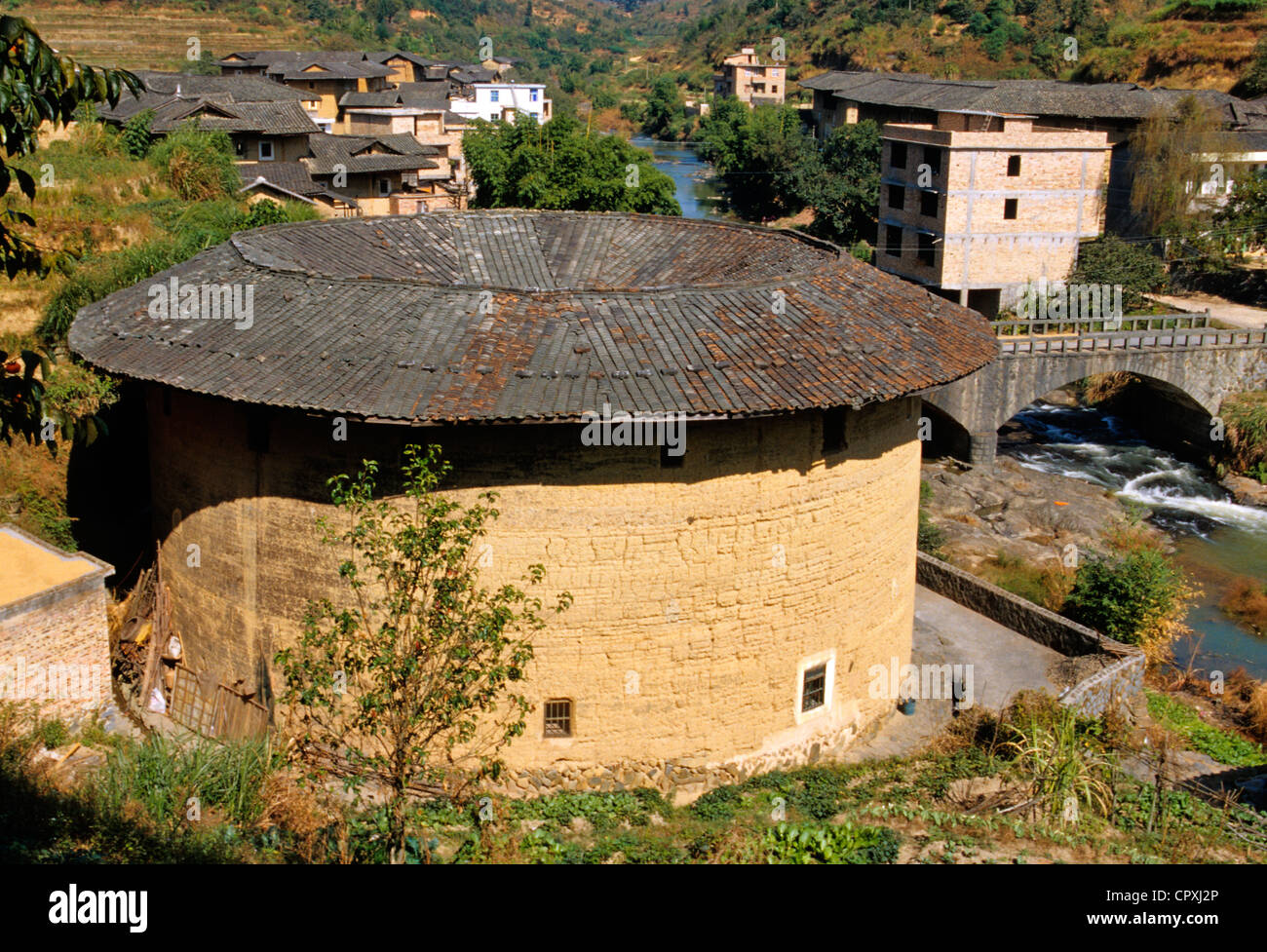 China Fujian Province Hukeng Tulou building communal living structure designed to be easily defensible made of brick stone or Stock Photo
