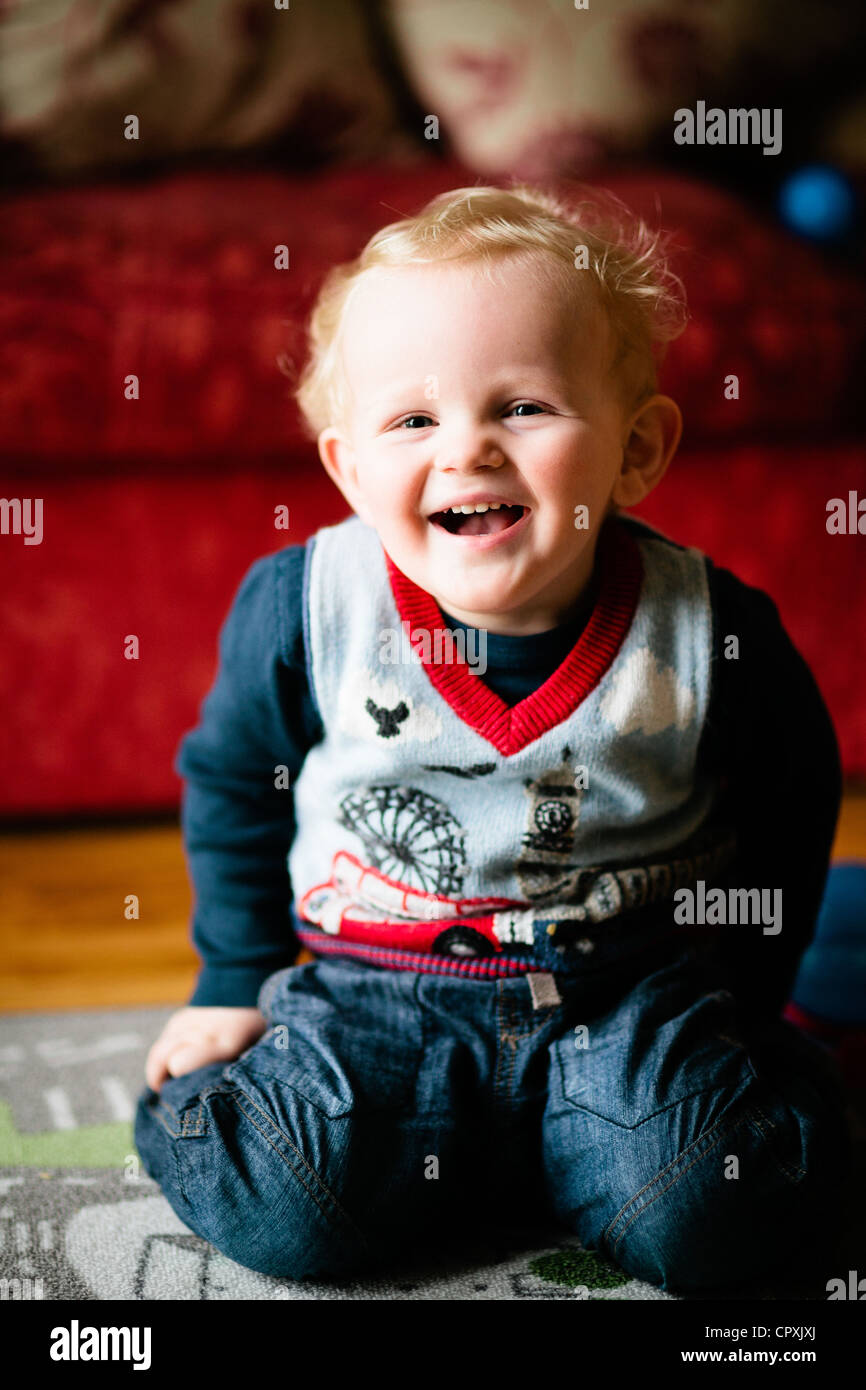 boy child laughing indoors in playroom Stock Photo