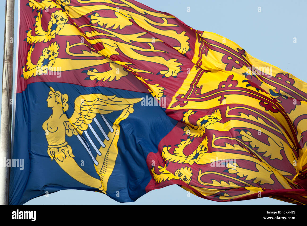 The Royal Standard flag flying above Buckingham Palace. This denotes whether the Queen is in residence Stock Photo