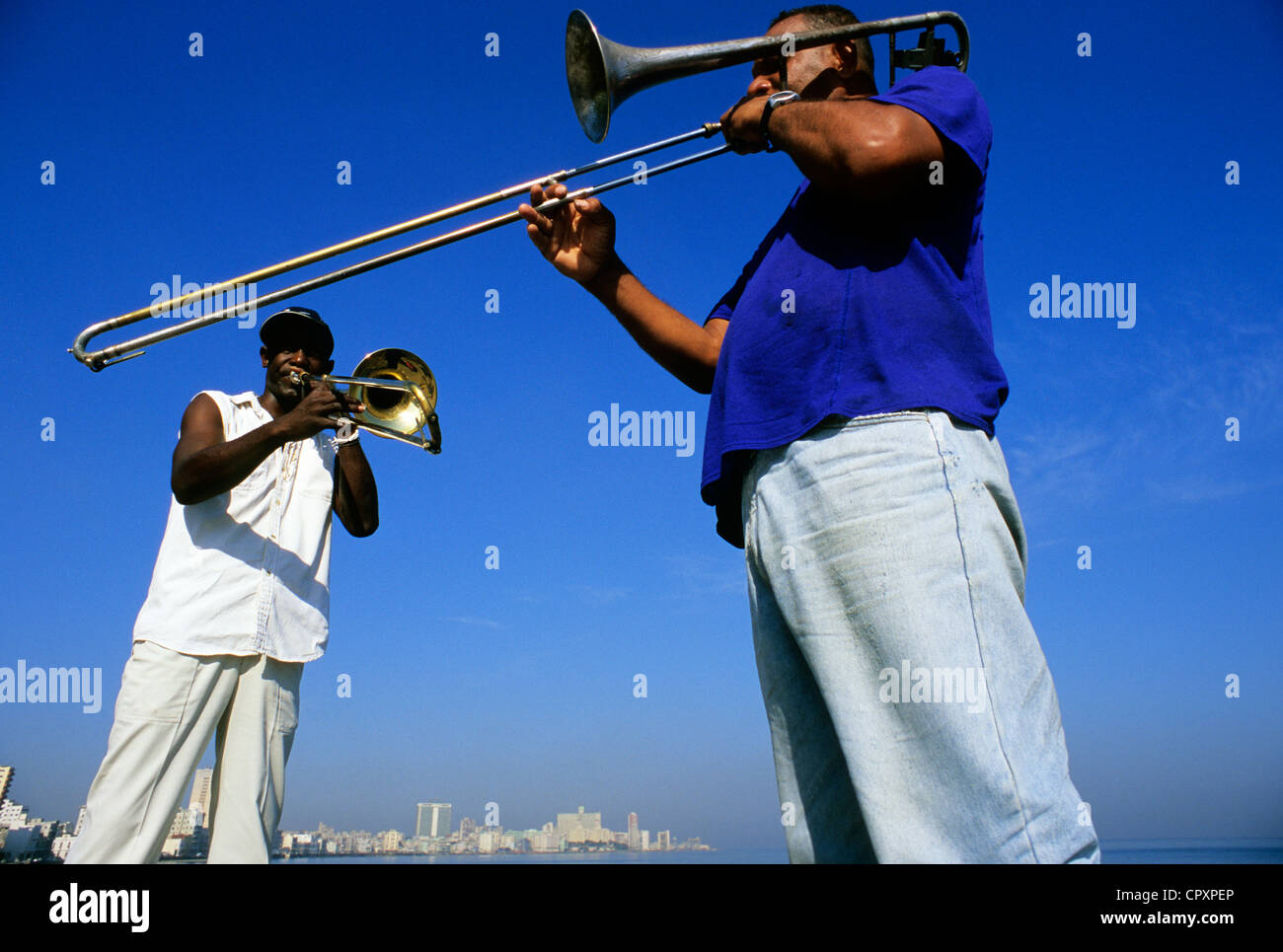 Cuba, Havana, duo of muscians playing tenor trombone on the Malecon