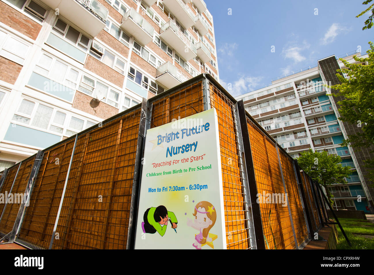 A child nursery by run down council flats in Queens Park, London, UK