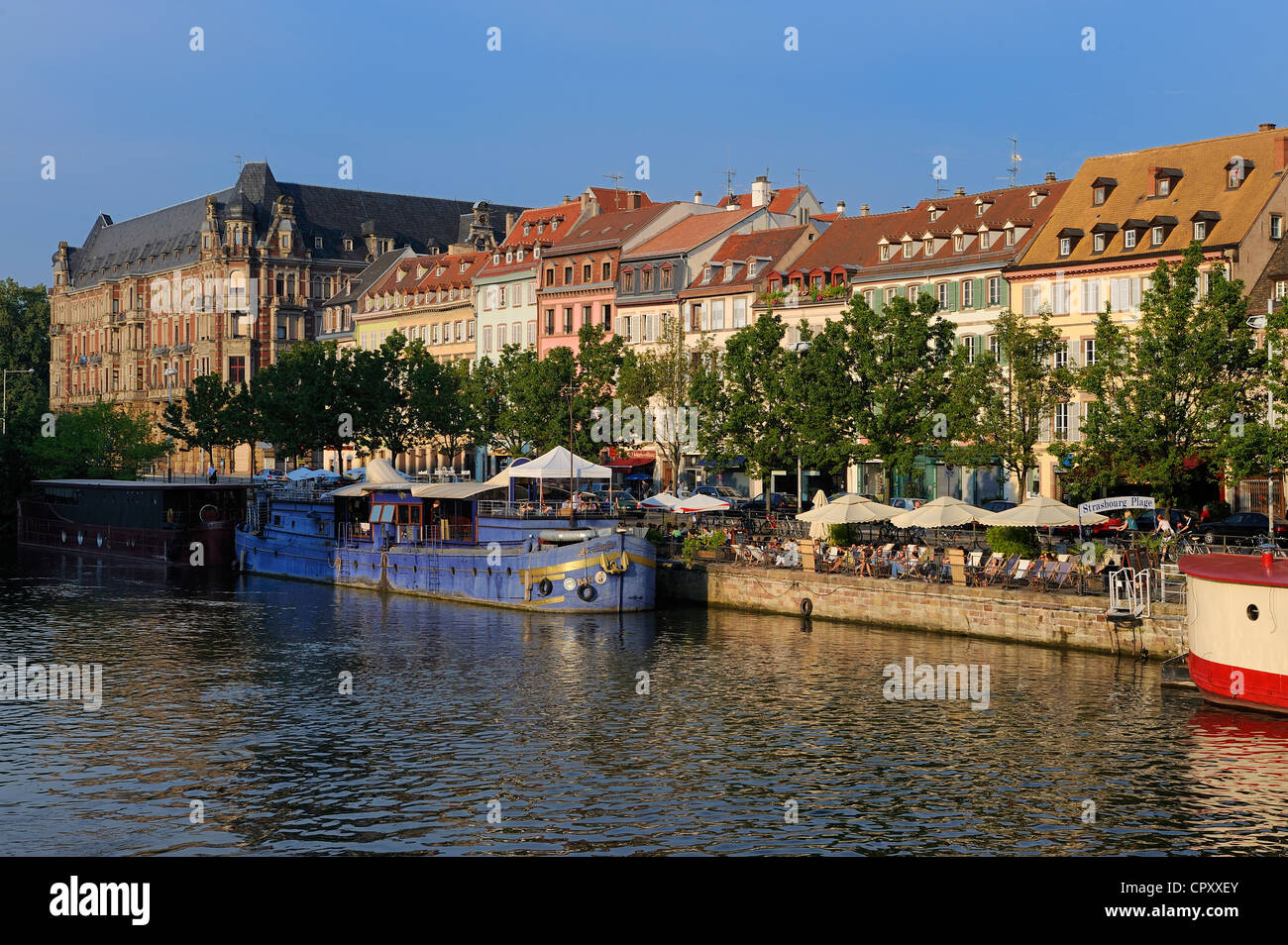France, Bas Rhin, Strasbourg, old town listed as World heritage by UNESCO, terraces of cafe on the banks of Ill River Stock Photo
