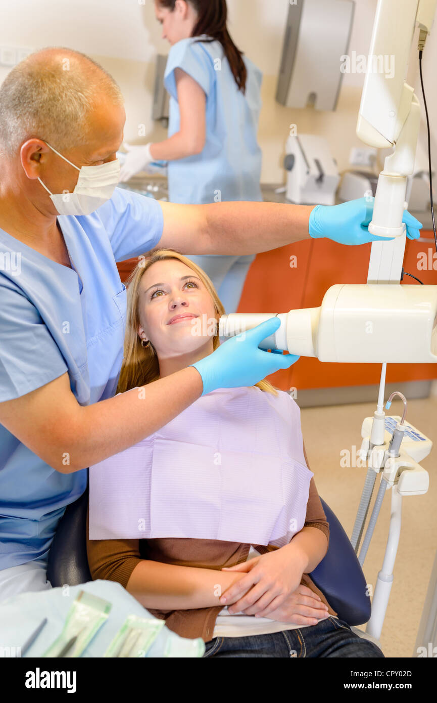 Dentist taking xray of female patient with nurse assistance Stock Photo Alamy