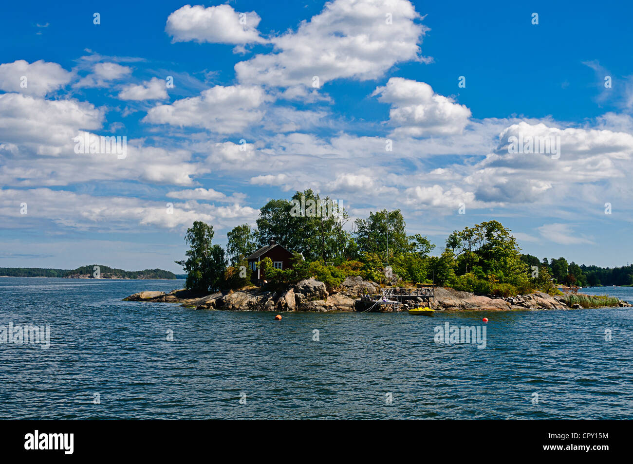 Red cottage on a small rocky island in Stockholm archipelago Stock Photo