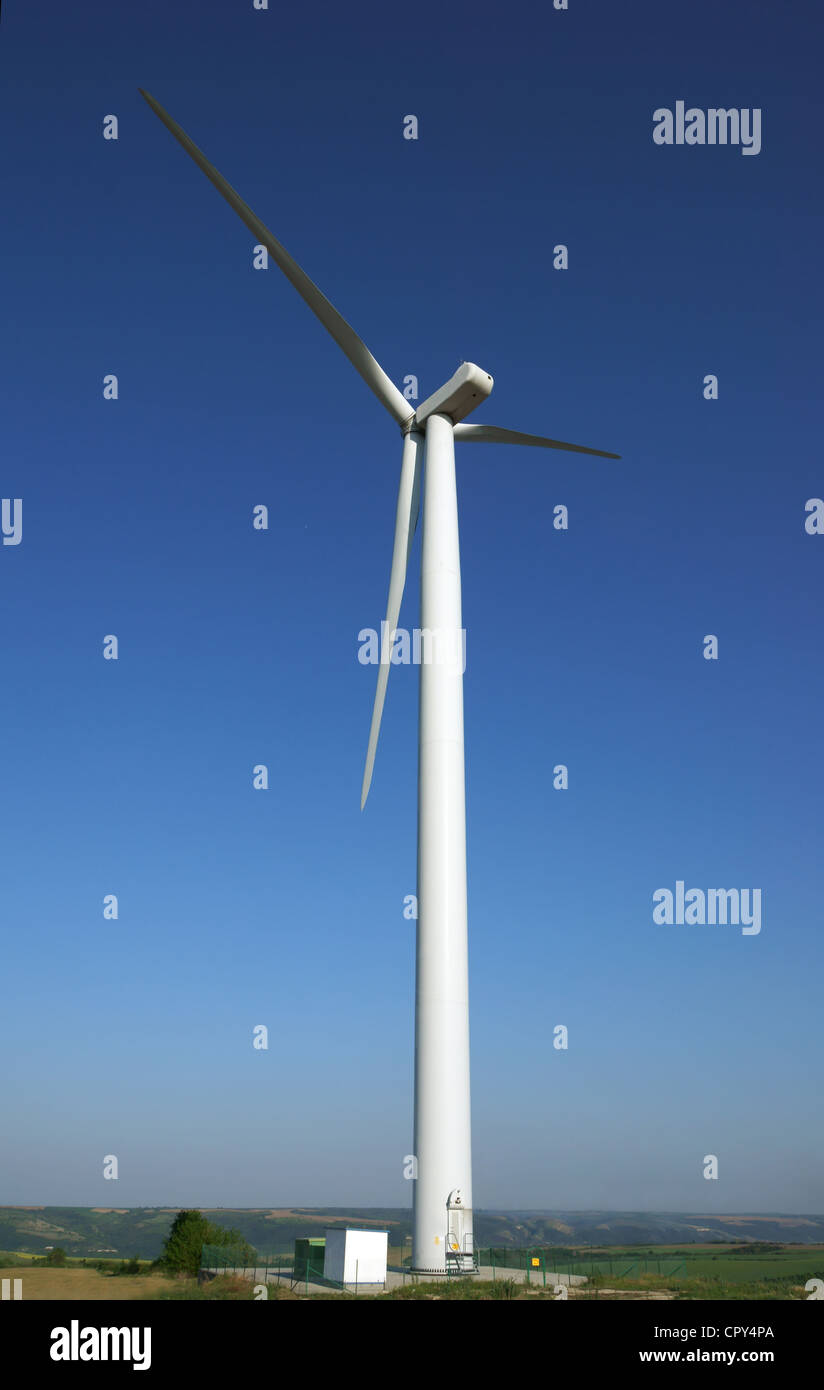 Wind turbine on blue sky background Stock Photo - Alamy