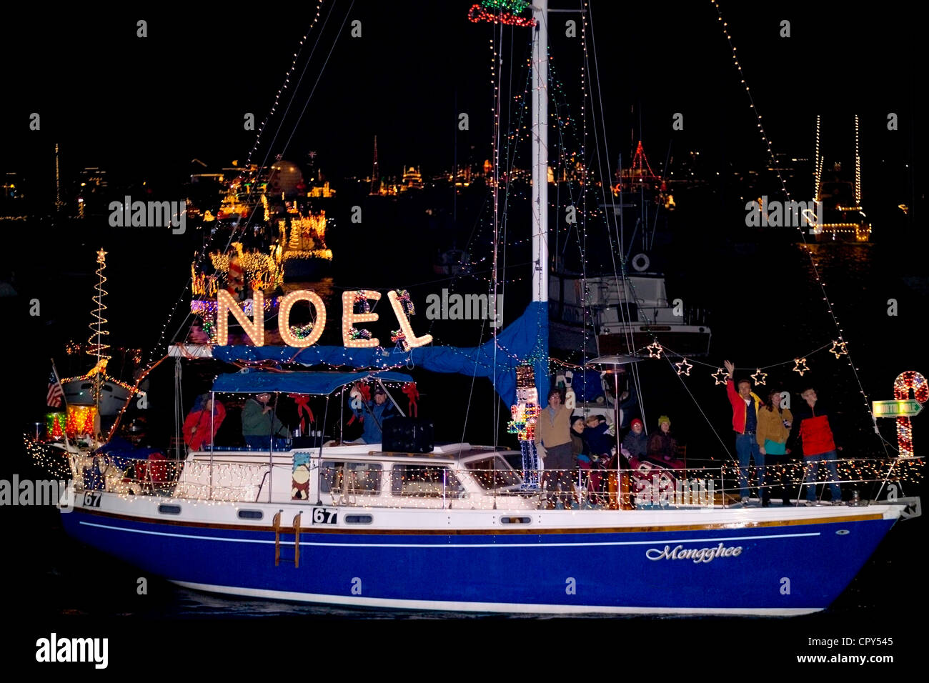 Gailydecorated vessels cruise around Newport Harbor during its 5night