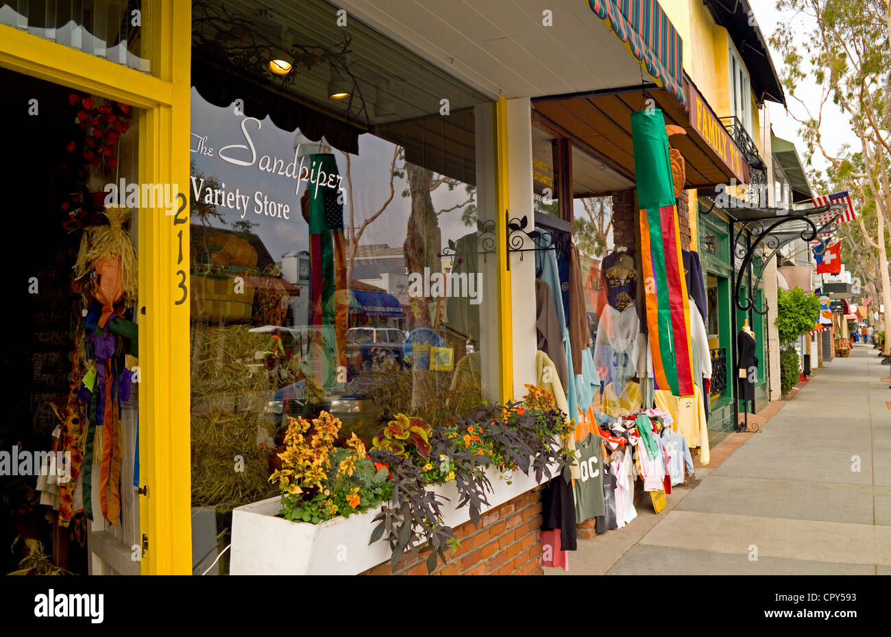 Shops and restaurants line Marine Avenue, the main shopping street that is only two blocks long on quaint Balboa Island in Newport Beach, California. Stock Photo