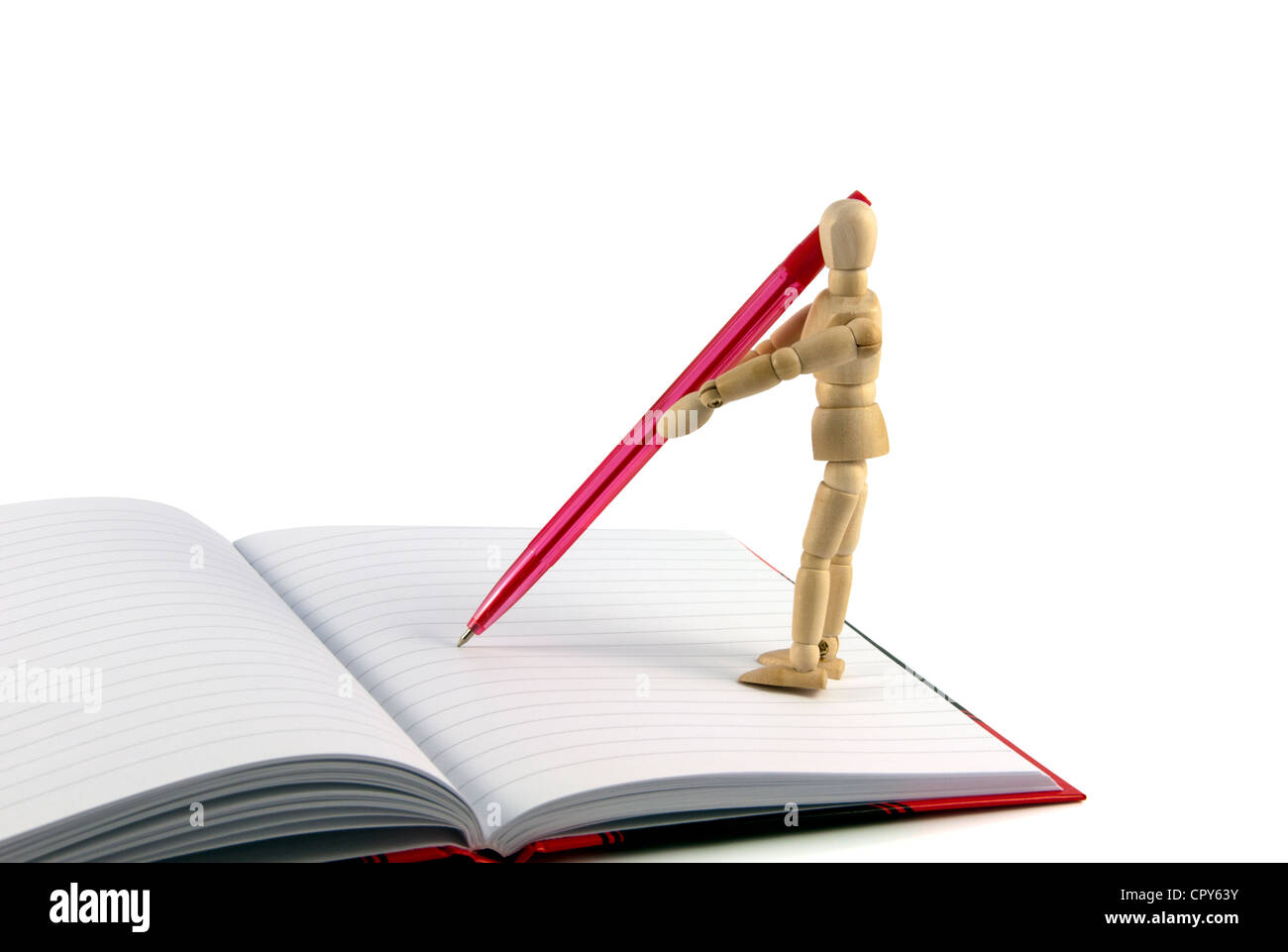 wooden puppet writing with red pencil Stock Photo Alamy