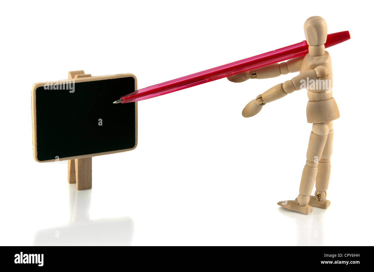 wooden teacher with blackboard and red pen Stock Photo