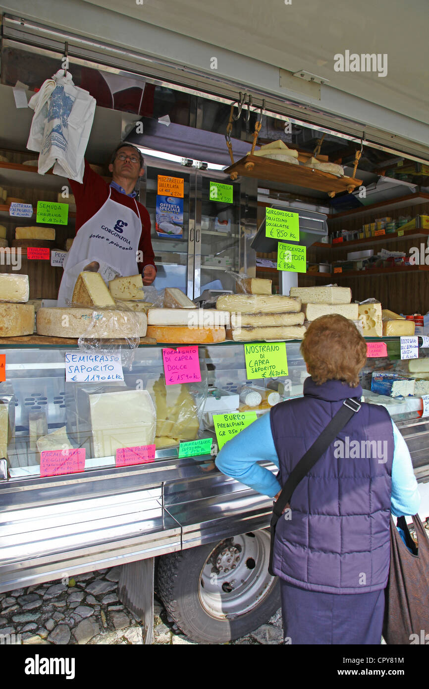 Cheeses for sale at a mobile market stall, Lenno Market, Lake Como, Italian Lakes, Italy Stock Photo