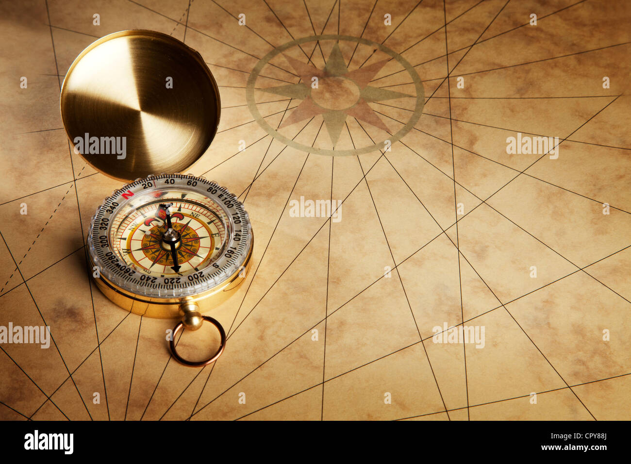 Close up view of the Compass on the old paper background Stock Photo ...