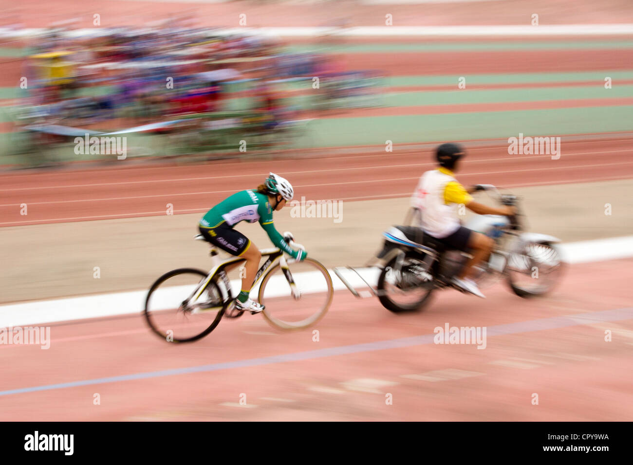 Woman Cyclist in velodrome race on track outdoor in Palma de mallorca sport festival Stock Photo