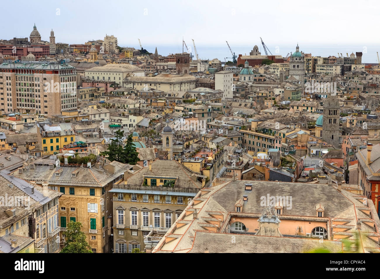 View over the rooftops of the old city of Genoa and the sea Stock Photo