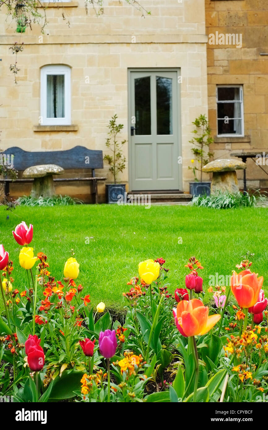 chipping campden house and flowers Stock Photo Alamy