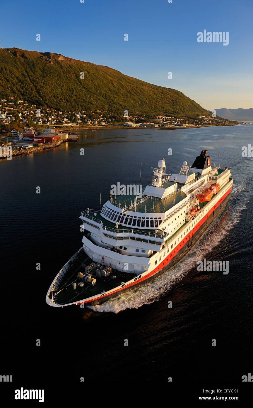 Norway, Troms County, Tromso harbour, the Coastal Express (Hurtigruten) in Tromsesundet Fjord Stock Photo