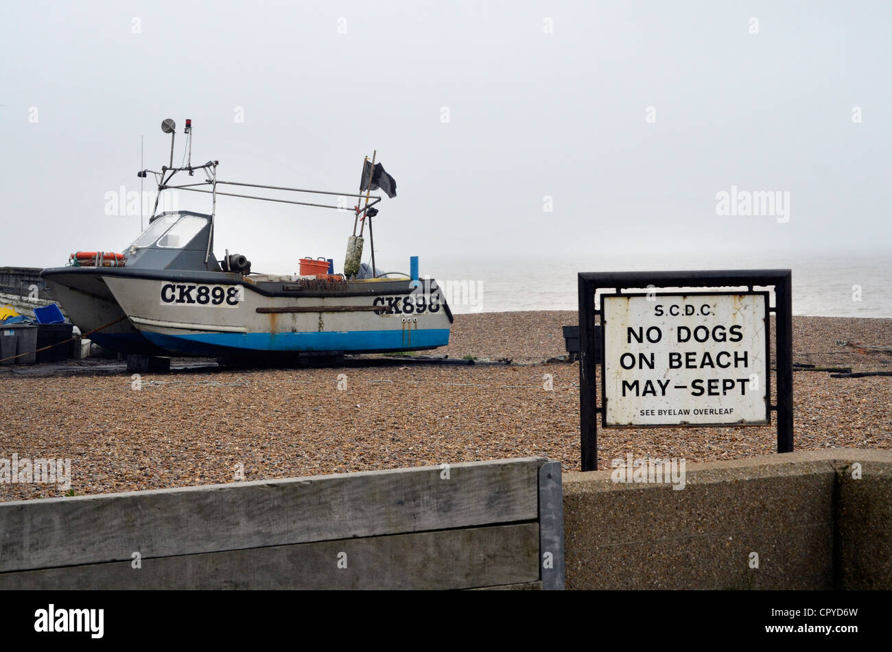 fishing boat and no dogs sign aldeburgh beach Stock Photo