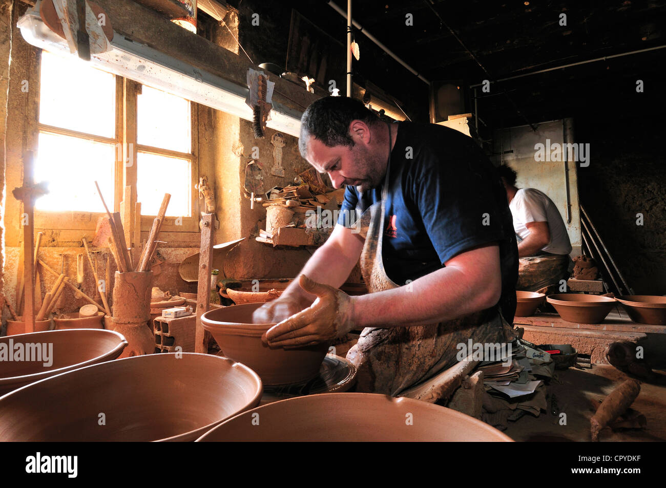The Not brothers at their family pottery, The Poterie Not, throwing by hand the cassole dishes  for cooking Cassoulet. Canal du Midi, Southern France Stock Photo