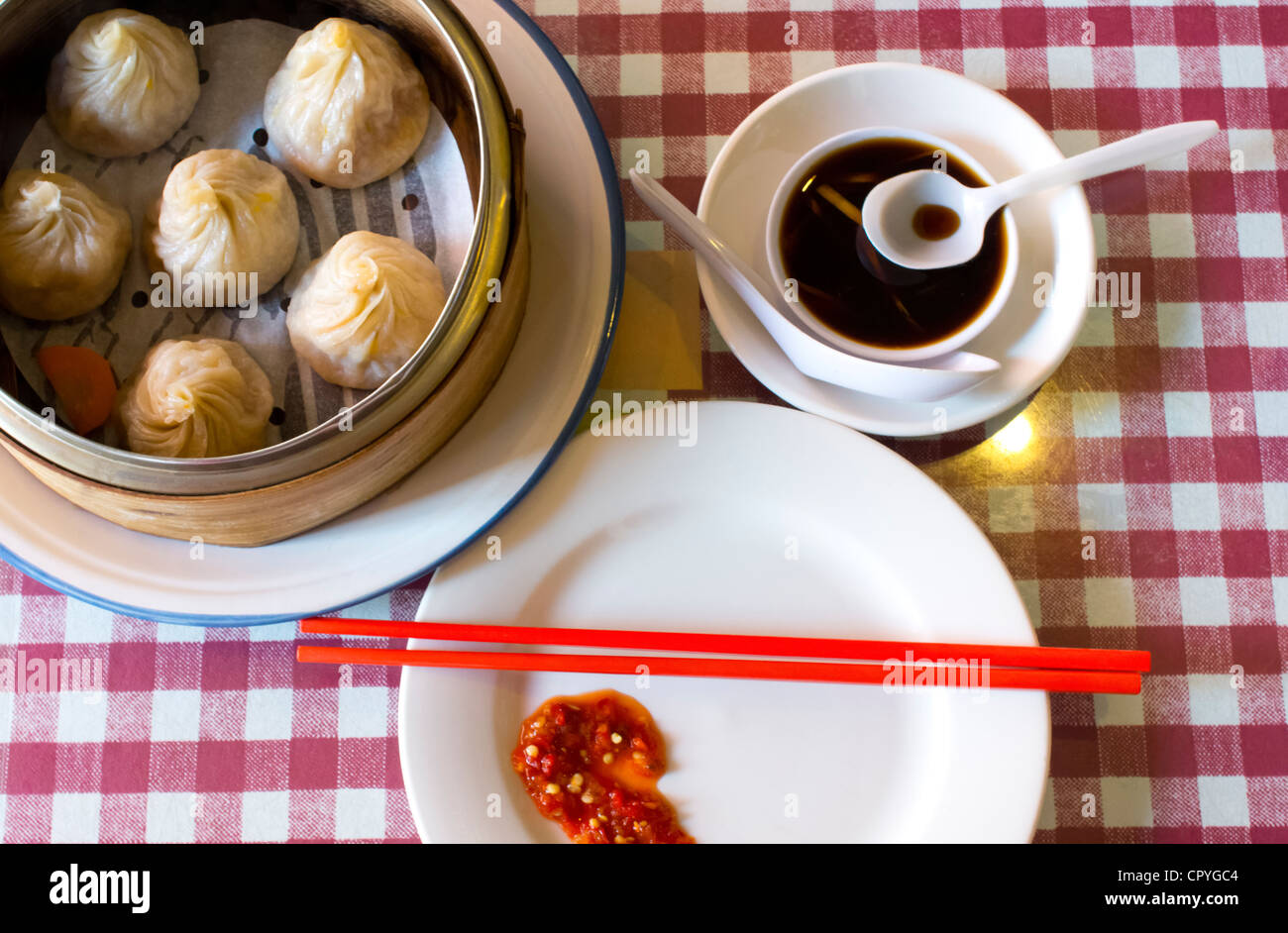 Dim sum steamed crab meat dumplings with hot sauce Stock Photo Alamy