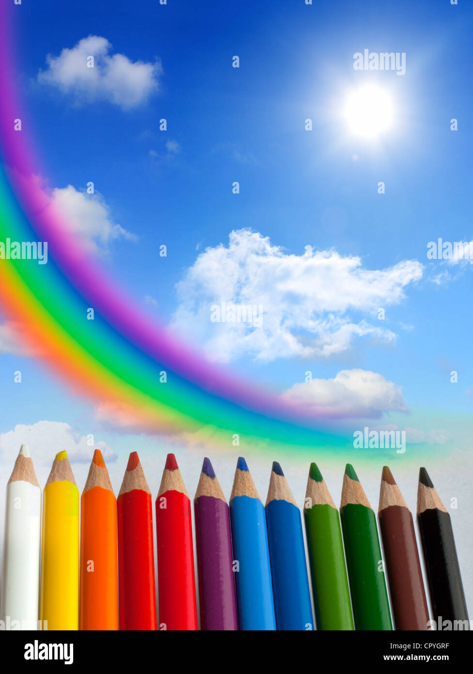 Crayons clouds rainbow and sun concept of background Stock Photo