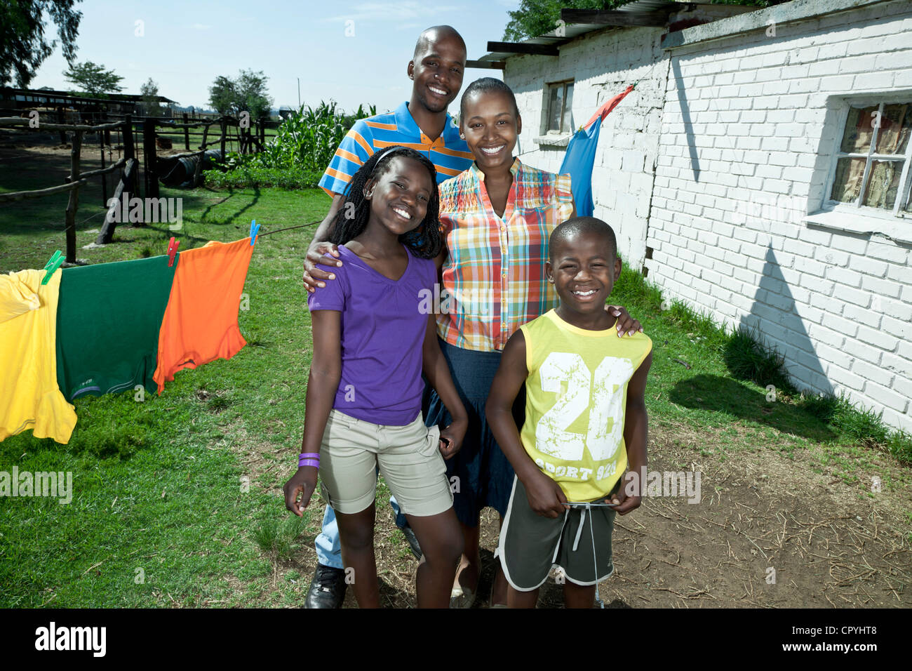 African family standing outside their rural home Stock Photo