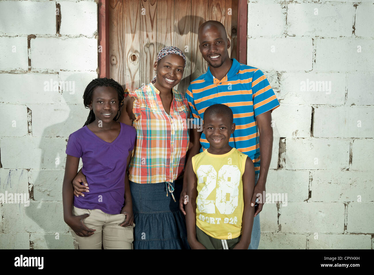 African family standing outside their rural home Stock Photo