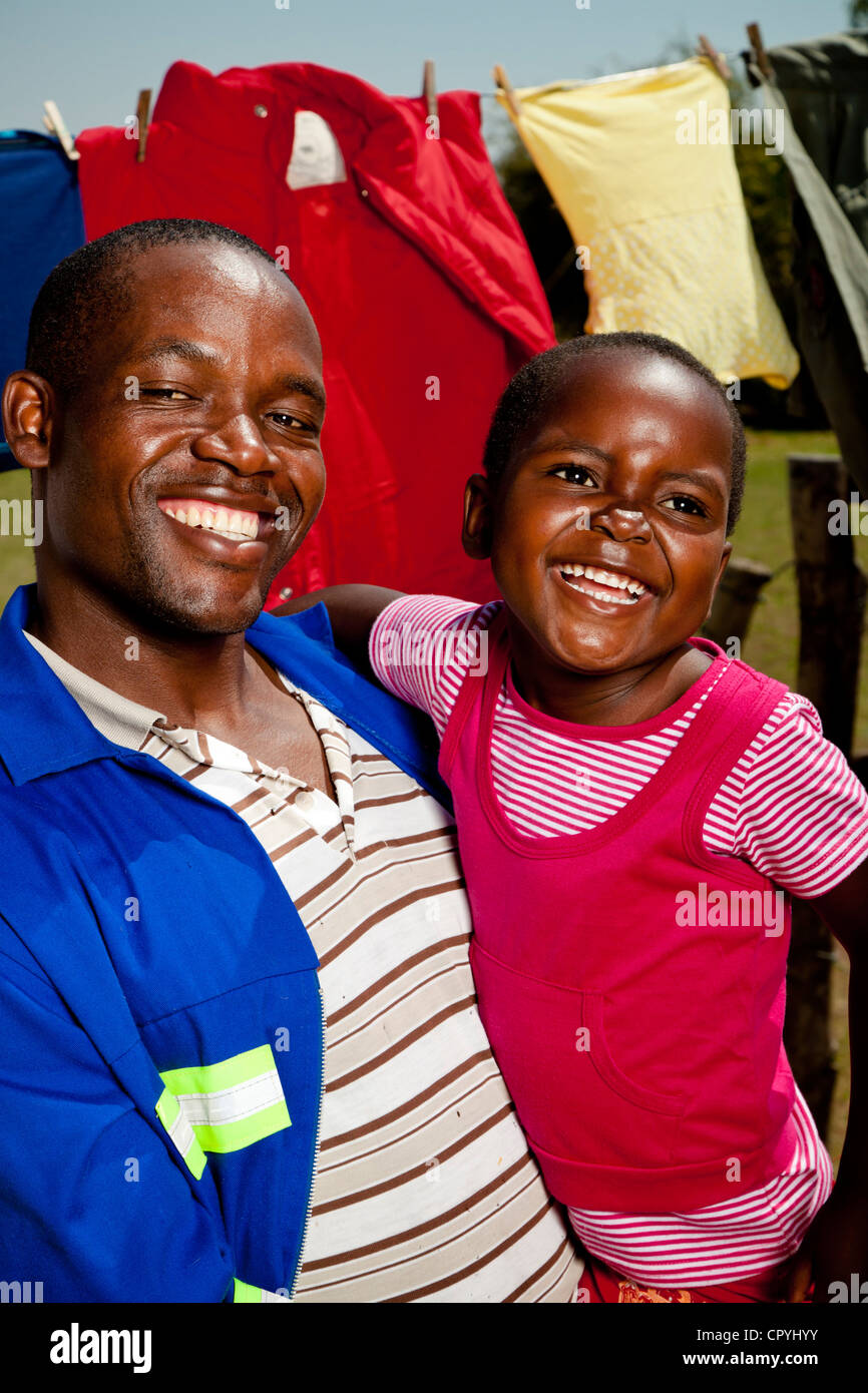 African father holding his daughter Stock Photo - Alamy